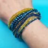 Βραχιόλι μακραμέ φαρδύ με χρυσούς αιματίτες και σειρές με κίτρινες και μπλε πέτρες